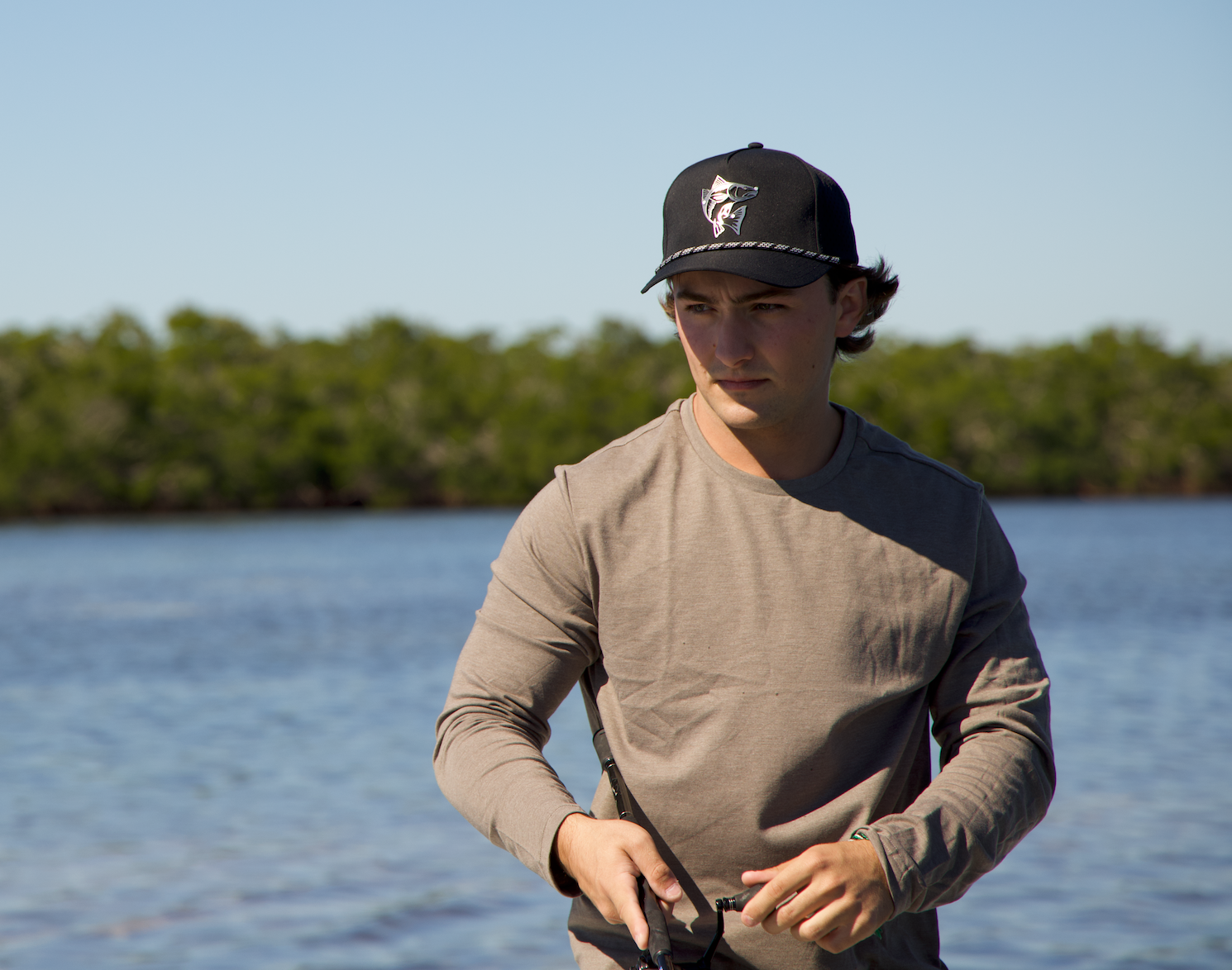 man wearing a hat at the beach
